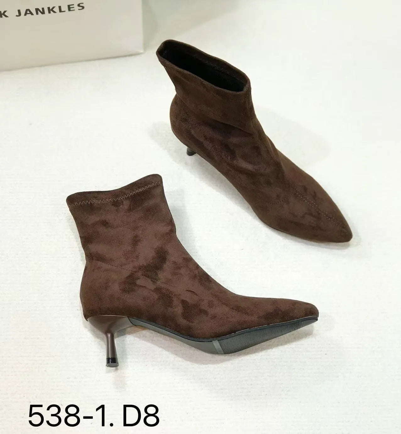 Women's black pointed toe ankle boots with stiletto heel and mid-calf height