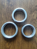 Wing Chun carbon steel power training ring shown in three different sizes for martial arts conditioning.