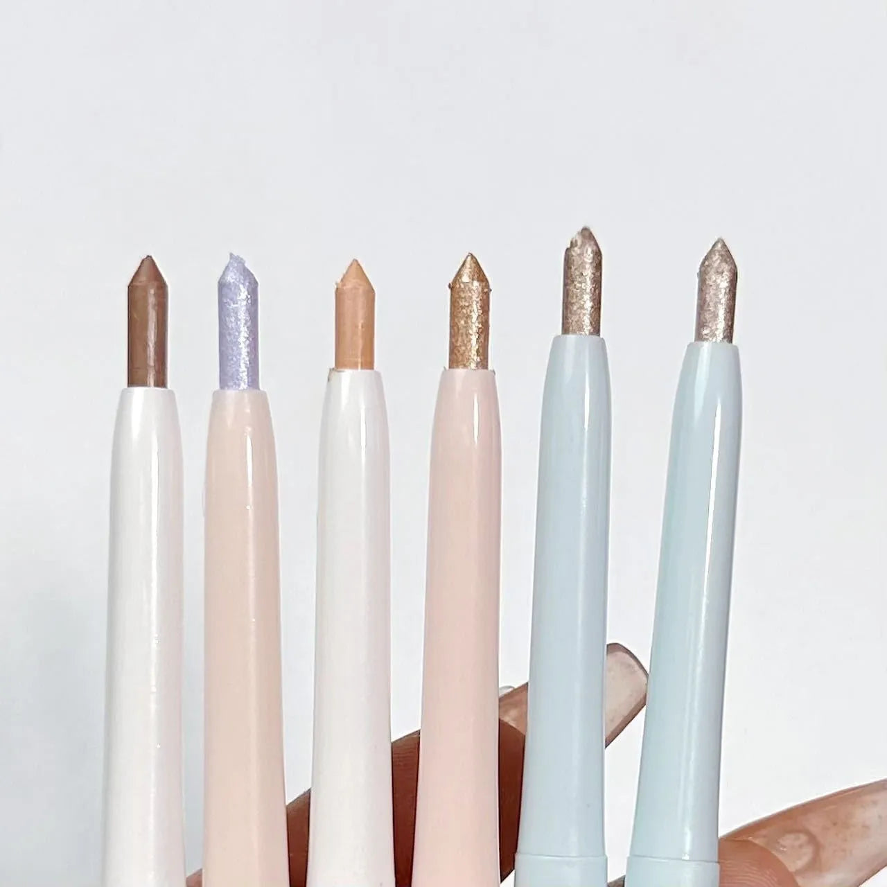 2-in-1 brightening eye shadow pen in a waterproof, smudge-proof formula showing multiple colour options.
