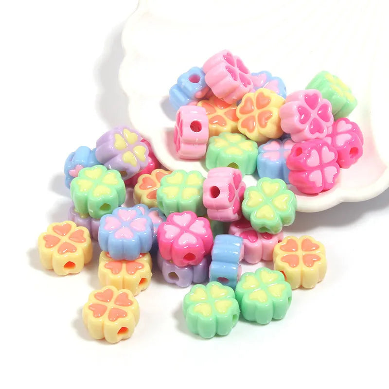 Acrylic four-leaf clover beads with frosted finish in mixed cartoon colours