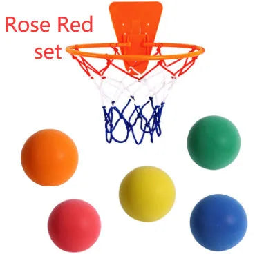 Assorted bright coloured silent high-density foam basketballs in different sizes with a basketball frame.