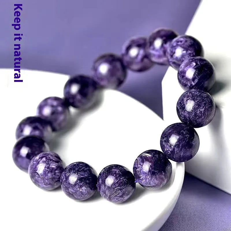 Natural transparent charoite crystal bracelet with platinum setting, showing bead size options.
