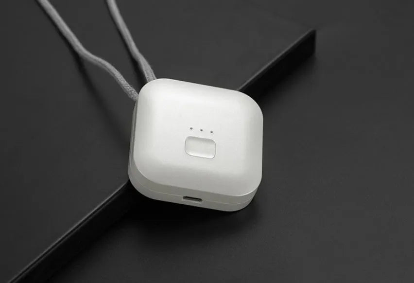 Mini USB air purifier necklace in pink showing compact wearable design with one-button control