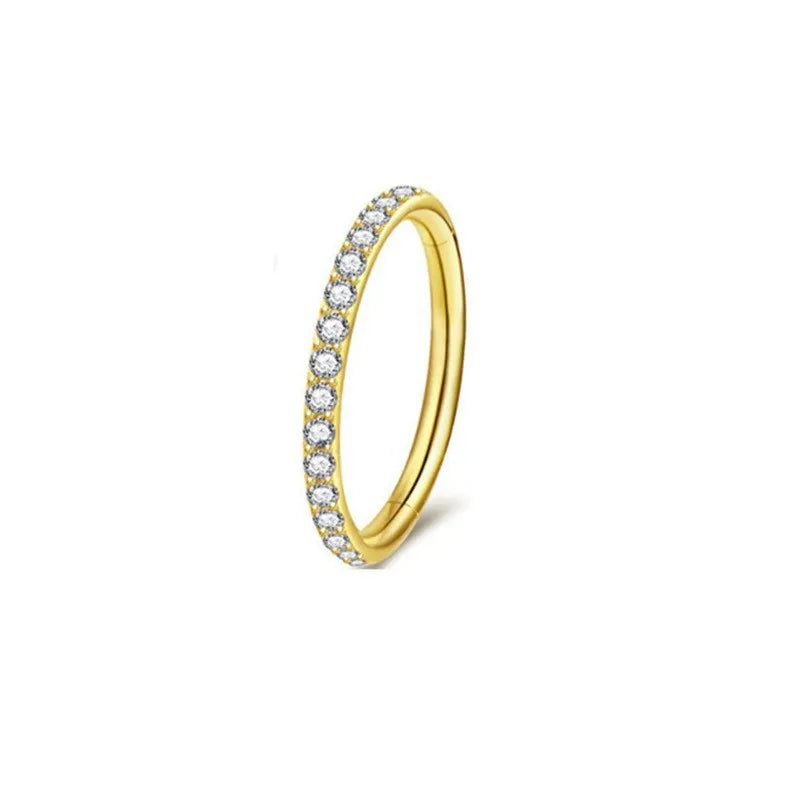 A round stainless steel seamless nose ring shown in gold, rose gold, black, and steel colour finishes.