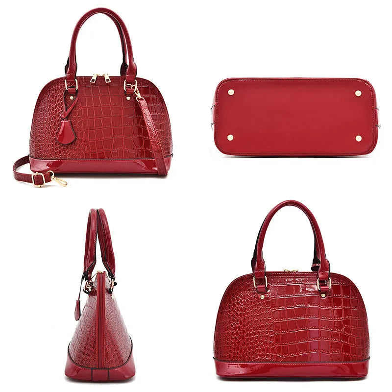 Shiny black PU leather shell-shaped crossbody bag showing its structured design and size.