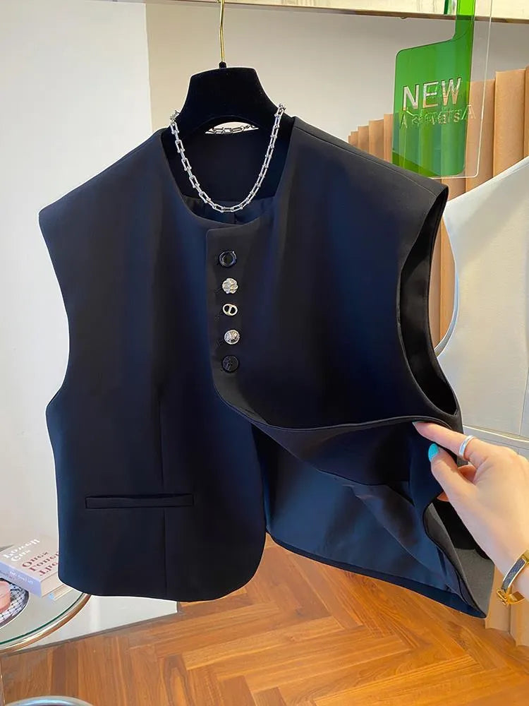 Women's loose-fitting beige polyester waistcoat vest with pockets on a hanger.