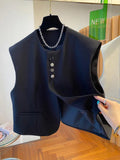 Women's loose-fitting beige polyester waistcoat vest with pockets on a hanger.