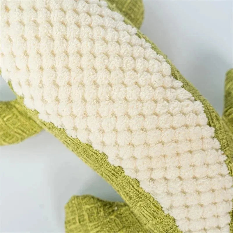 Blue, green, and red corn cob shaped plush dog toy with a textured surface on a white background.