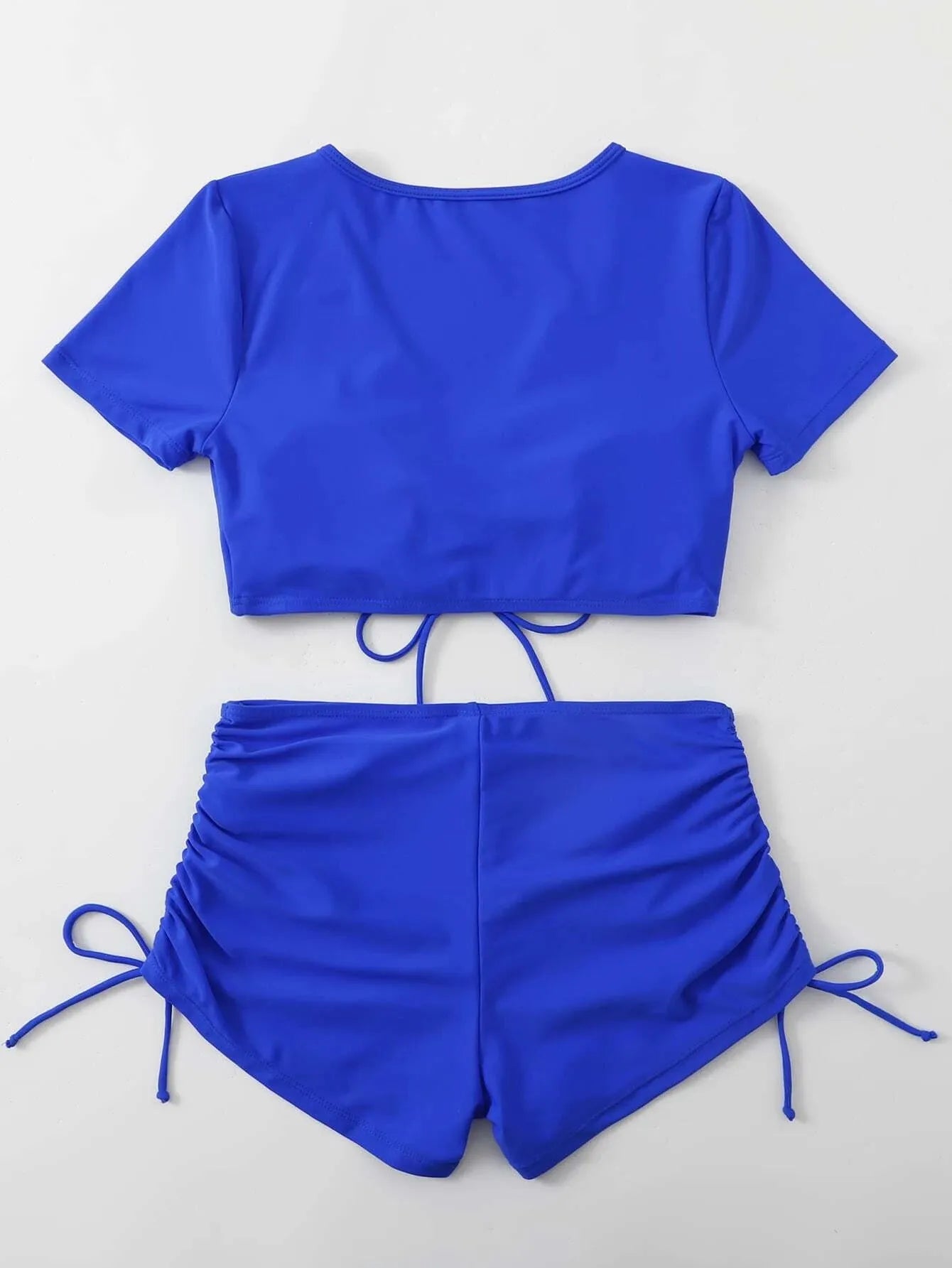 Lady's dark green two-piece bikini with lace-up front and bow detail on the top.