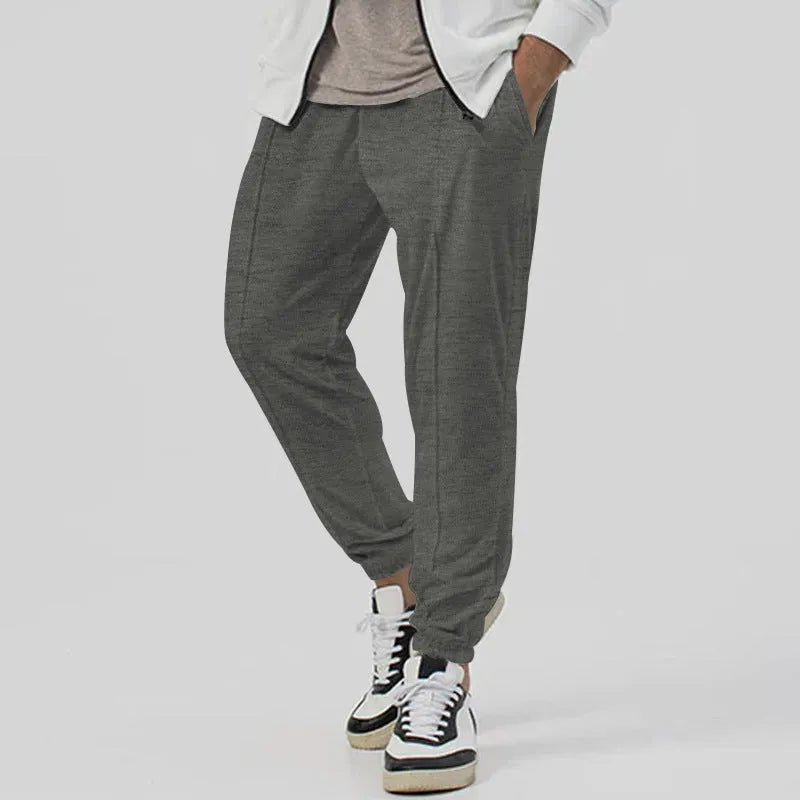 Men's grey cotton blend track sweatpants with straight-leg design and mid waist