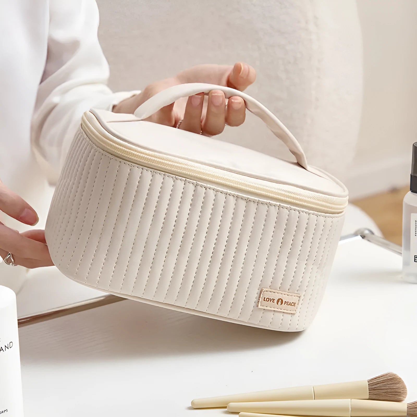 Open-top cake shaped makeup bag in solid colour PU leather, shown in a light blue colour variant.