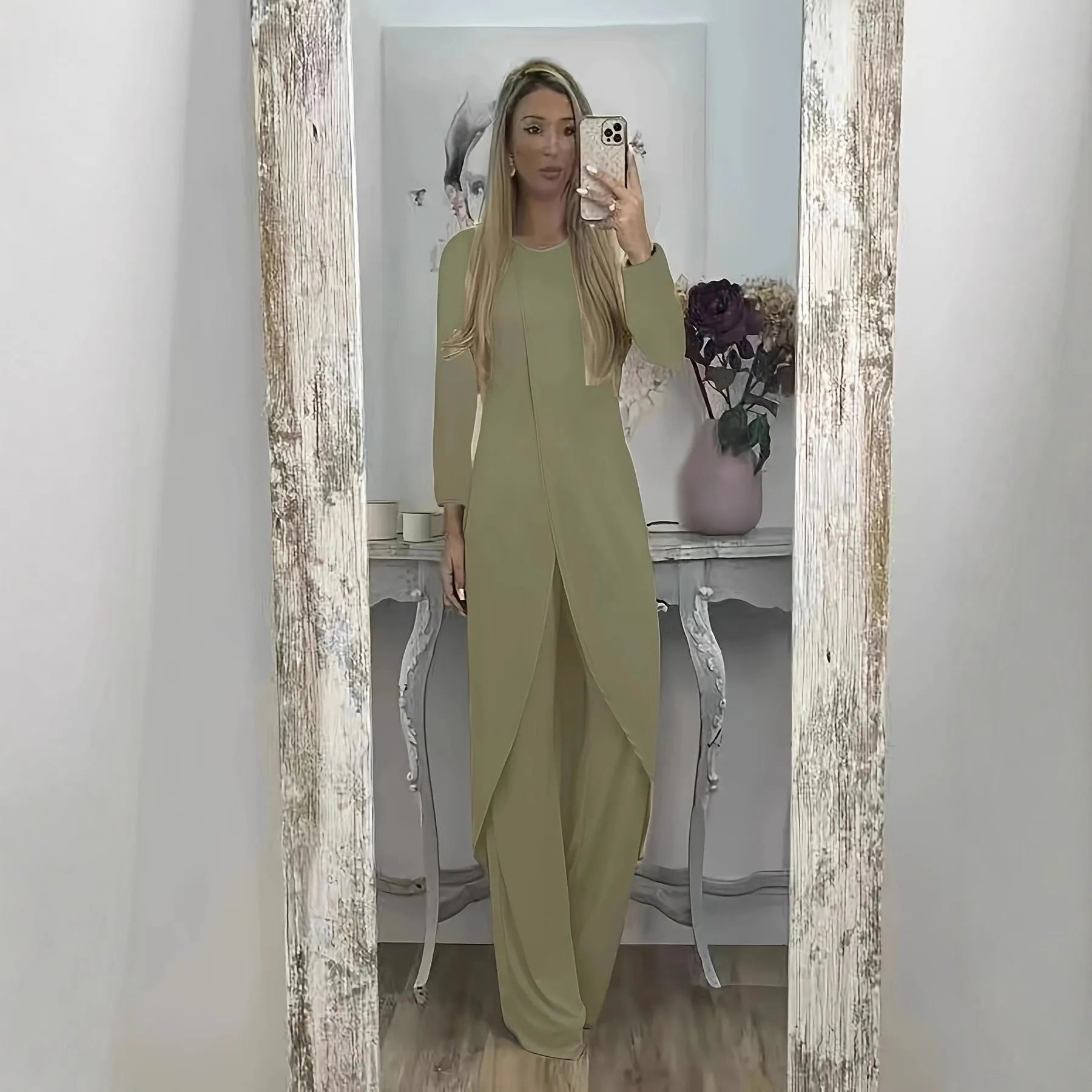 Casual loose-fitting long sleeve top and trousers lounge set in polyester.