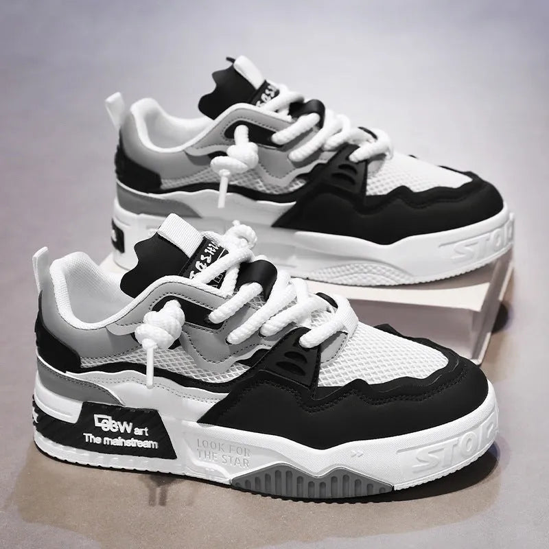 Men's low-top canvas board shoes in a colour-matched pattern with a flat rubber sole.
