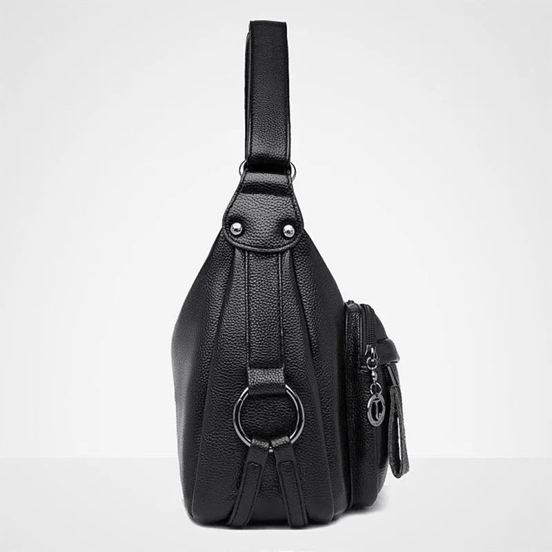 Large black PU shoulder bag with crossbody strap showing multiple internal compartments and zipper closure