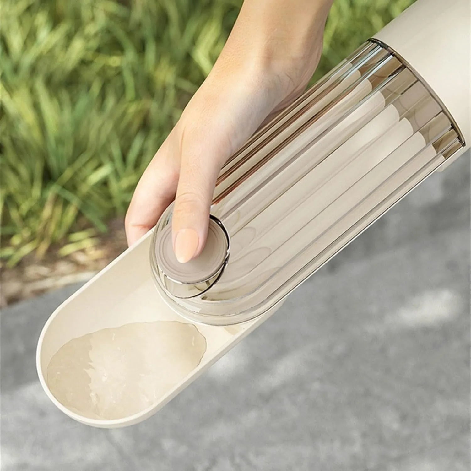 Foldable dog water bottle with food dispenser in beige colour for outdoor walking