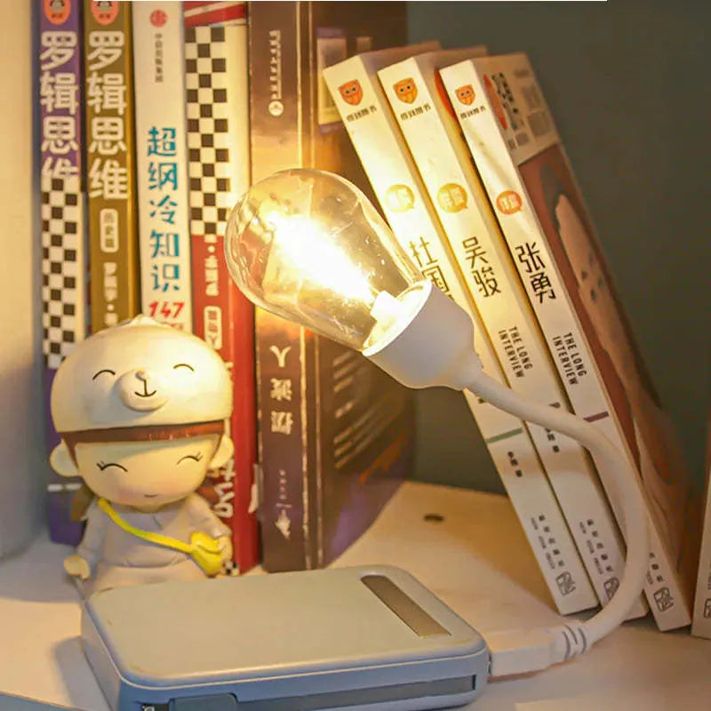 USB rechargeable folding night light with tungsten S14 bulb showing warm white illumination