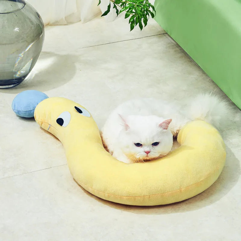 Blue or yellow rectangular pet sleeping pillow measuring 62cm by 39cm on a floor.