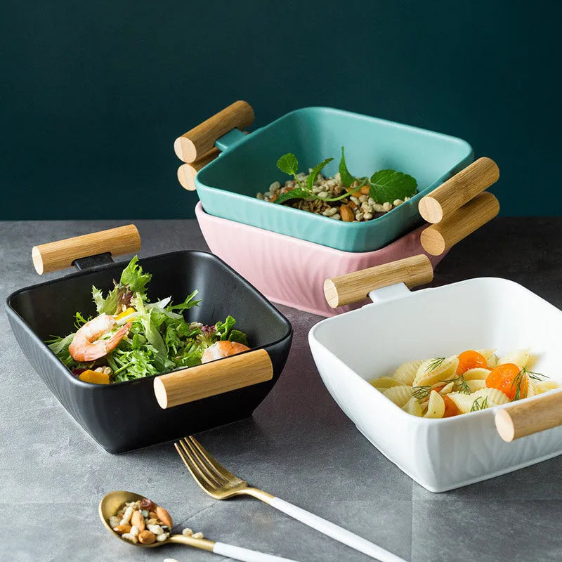 Porcelain ceramic bowl with irregular shape and matching lid in modern design