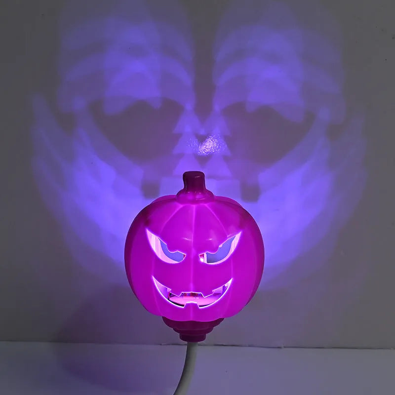 Plastic pumpkin-shaped decorative lamp with USB cable, showing purple or yellow light option.