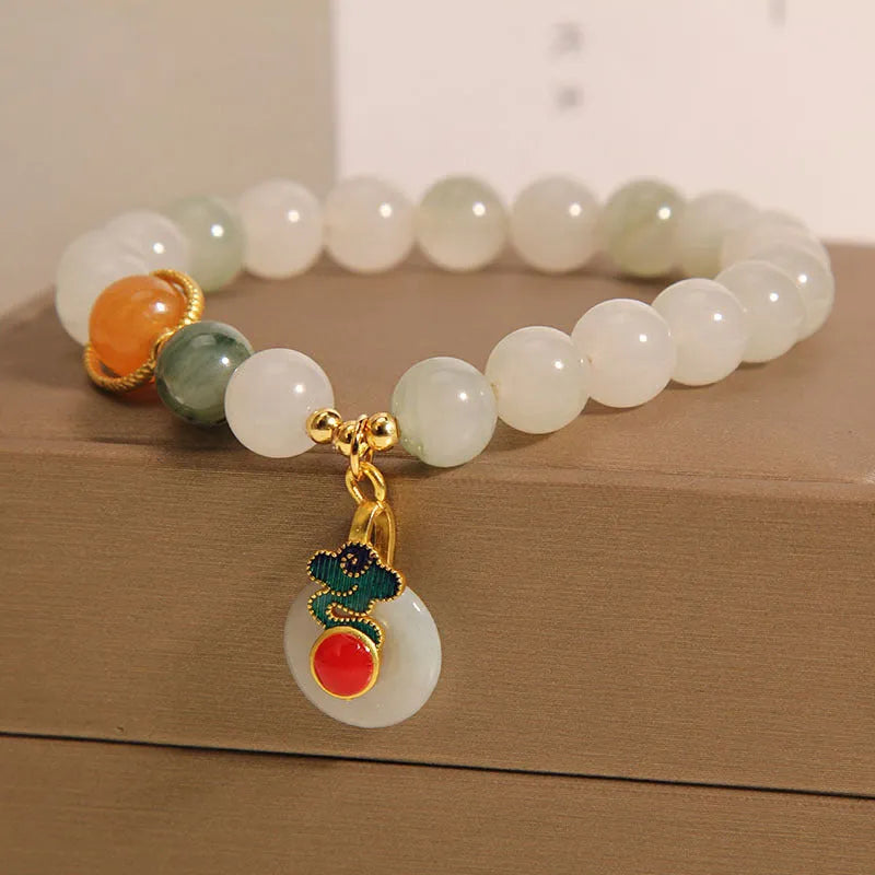 Women's ice jade and pearl bracelet with a retro-styled peace jade buckle.