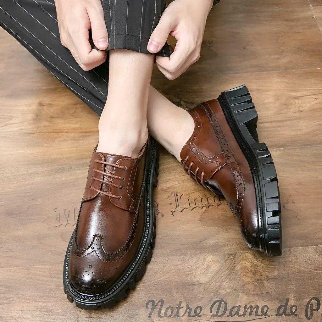 Men's black and brown brogue Oxford shoes with round toe and decorative detailing for business formal wear