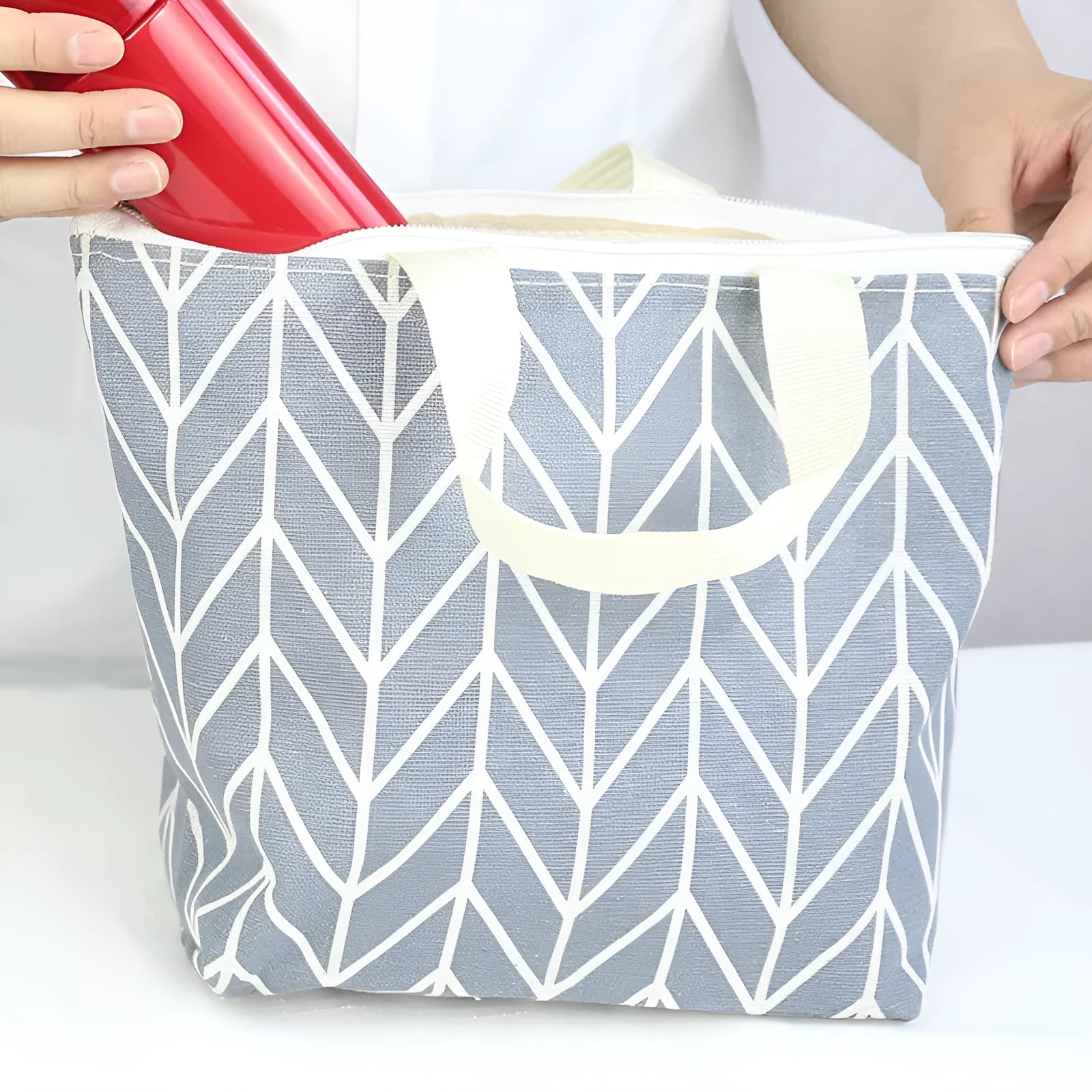 Arrow pattern cosmetic bag with zipper, made from moisture-resistant polyester fabric.