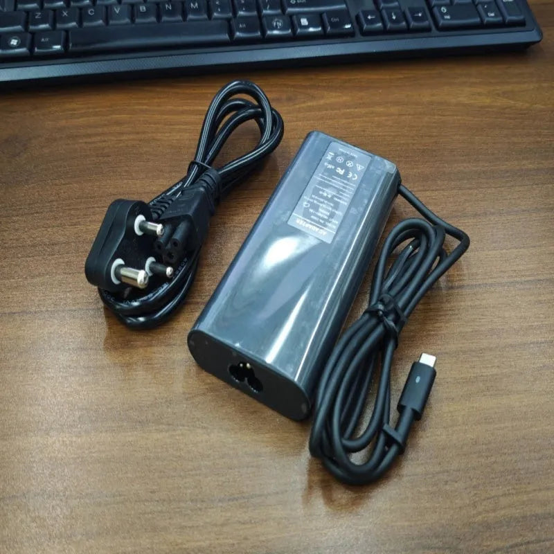 Black 65W USB Type-C laptop power adapter with international power cords