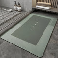 Blended fabric floor mat in an oval shape on a bathroom floor, available in multiple colours and sizes.