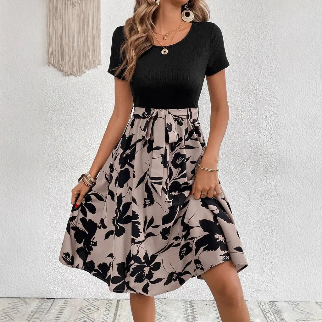 Women's khaki A-line dress with floral print and lace-up front detail.