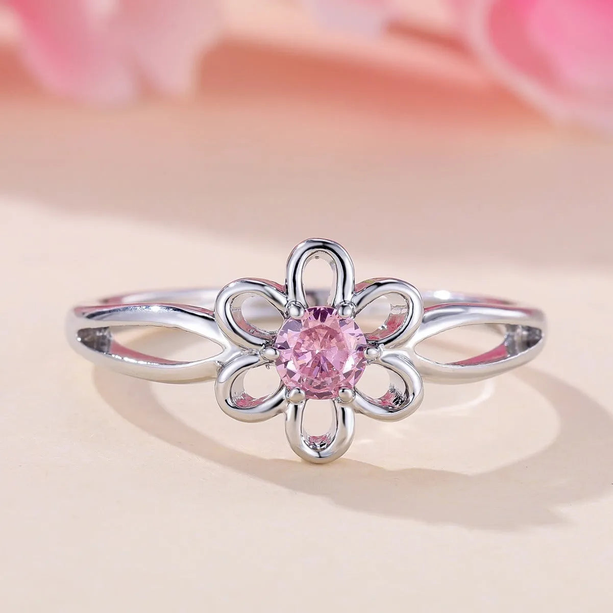 Lady's hollowed floral fashion ring in electroplated copper, platinum pink diamond colour.