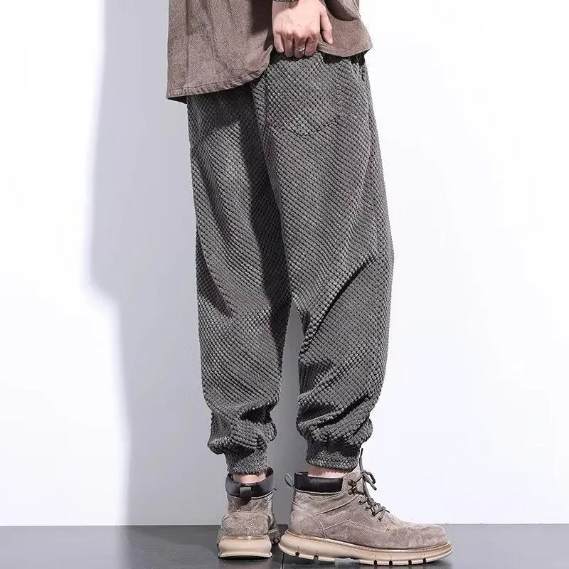 Men's grey ankle-tied sweatpants with straight leg cut and adjustable cuff ties
