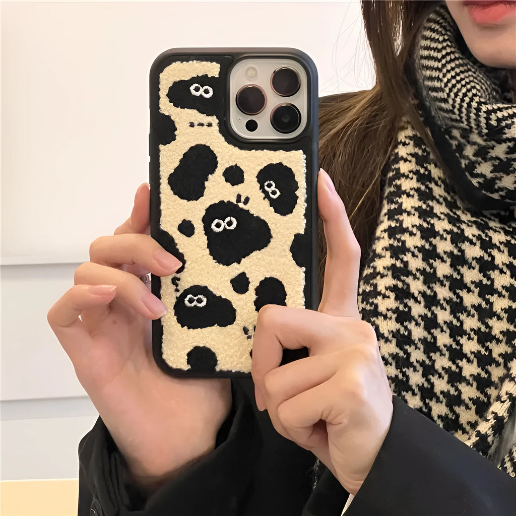 Black plush soft back phone case featuring a fairy character design for compatible iPhone models.