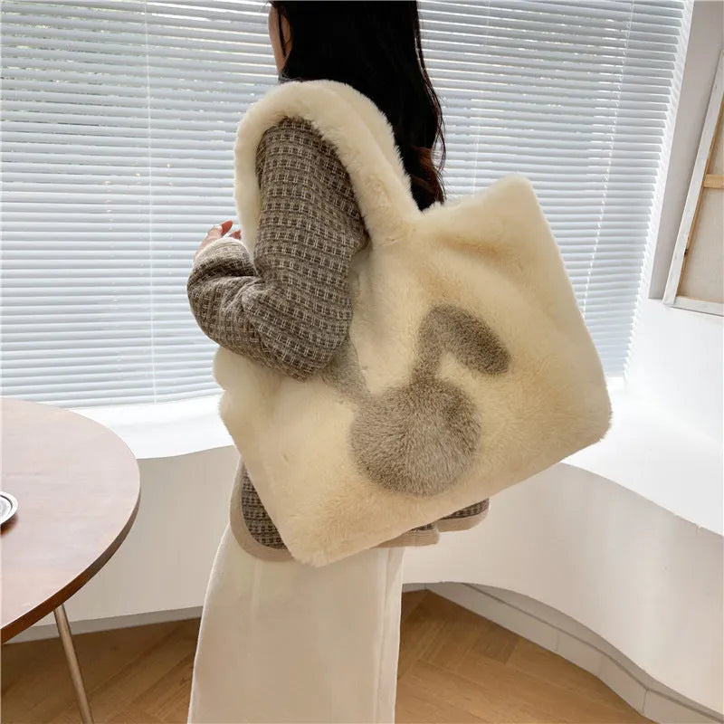 Plush shoulder bag with cartoon rabbit ears detail in solid colour