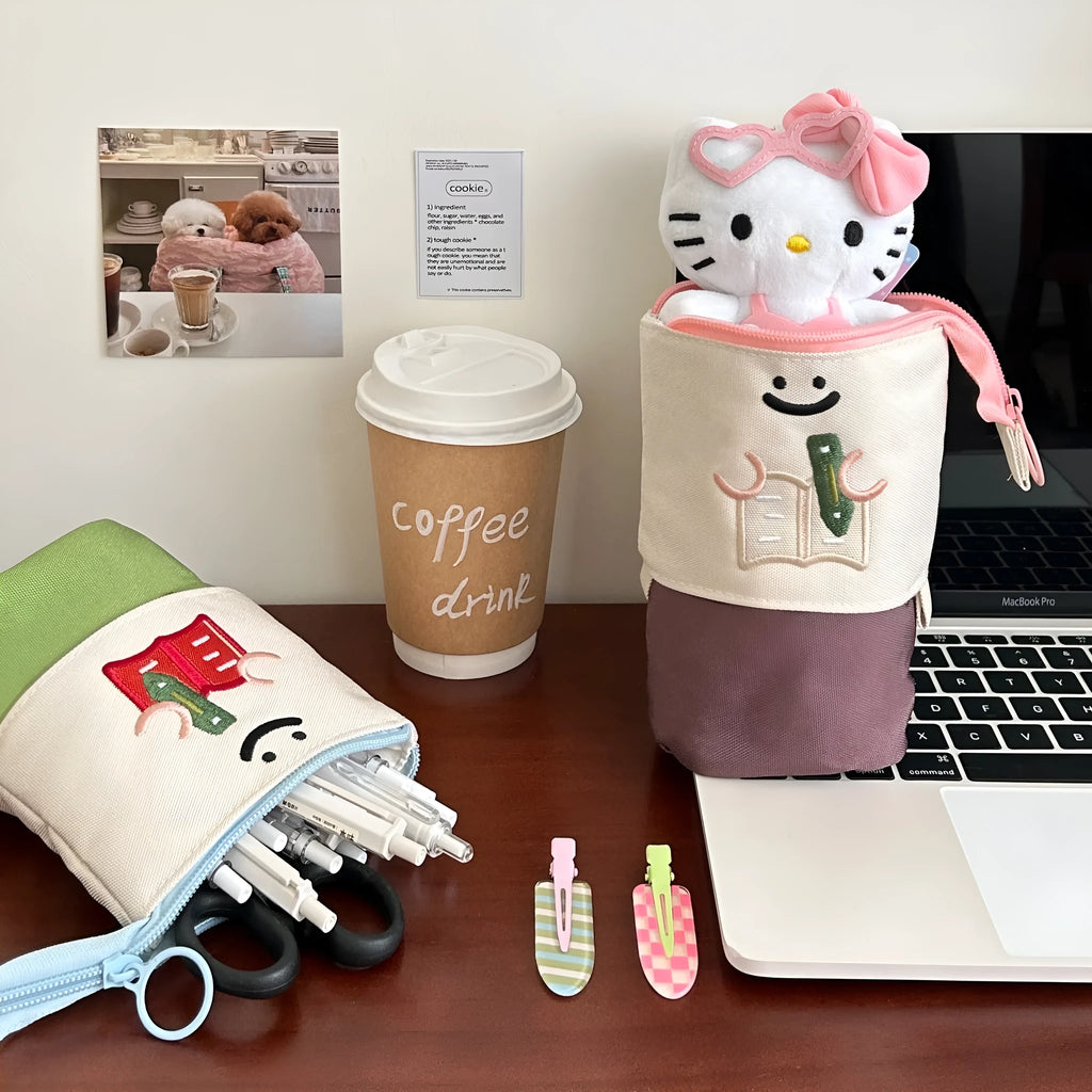 Brown Korean-style cartoon collapsible pencil case made from Oxford fabric, shown open.