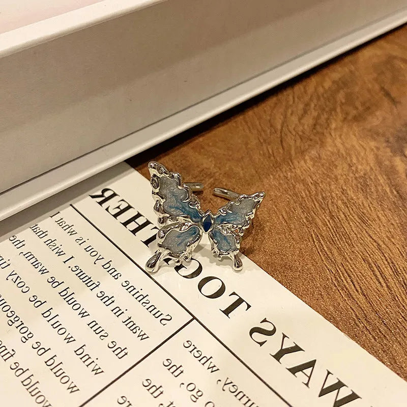 Women's copper butterfly ring with dripping oil finish and adjustable open loop design