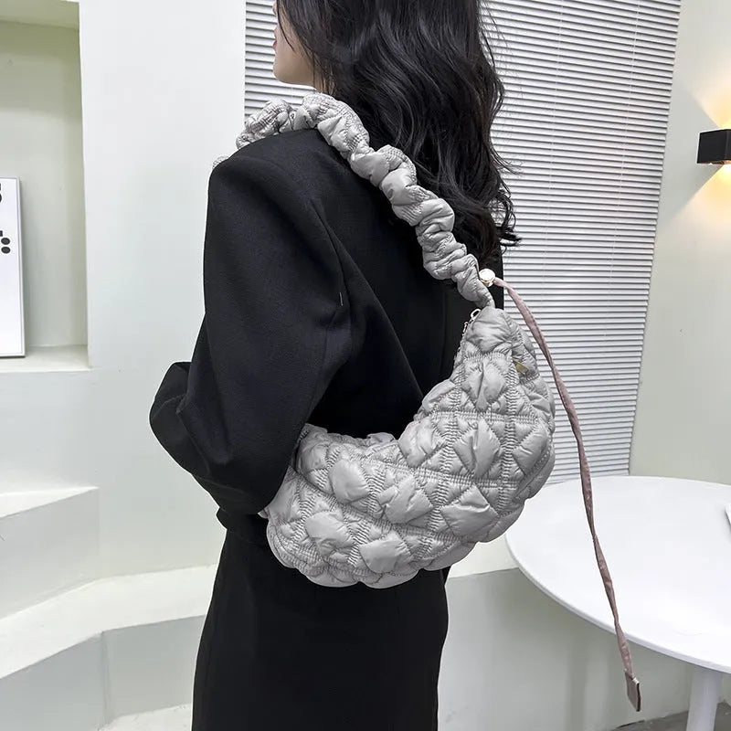 Women's casual nylon messenger bag in beige colour, showing front view with shoulder strap.
