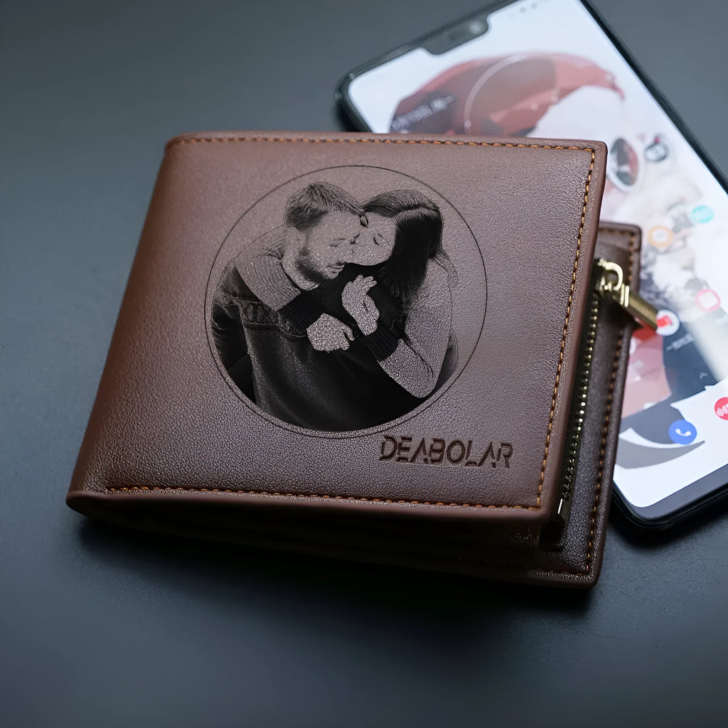 Men's brown leather wallet with a silver zipper closure laid flat.