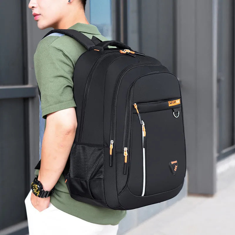 Men's large capacity Oxford cloth schoolbag in red with spliced design and air pillow straps.