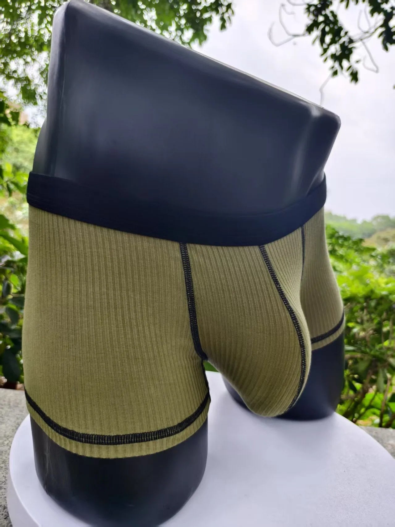 Men's solid colour breathable boxers in army green, shown flat.