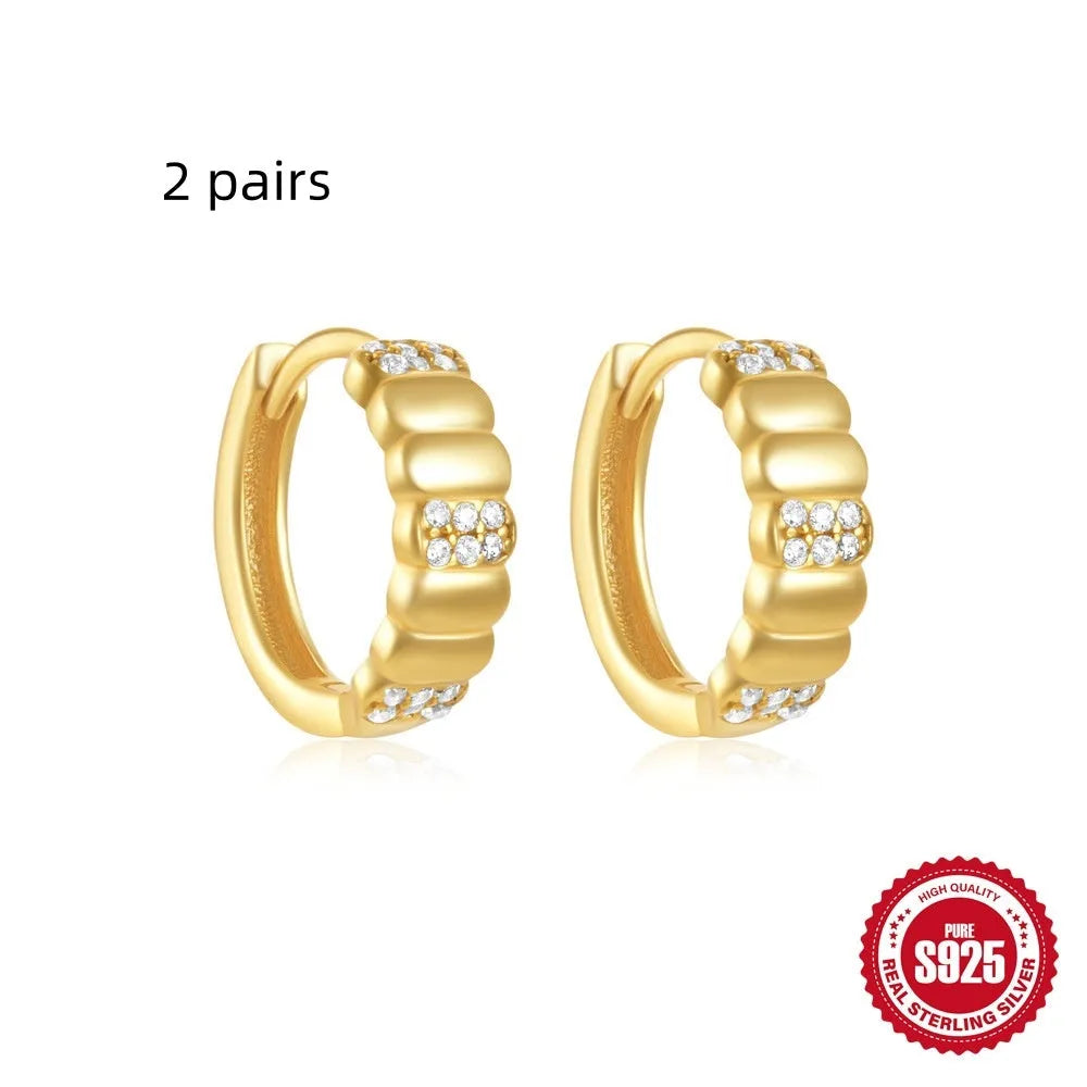 Sterling silver geometric stud earrings with small round designs in gold or silver electroplated finishes