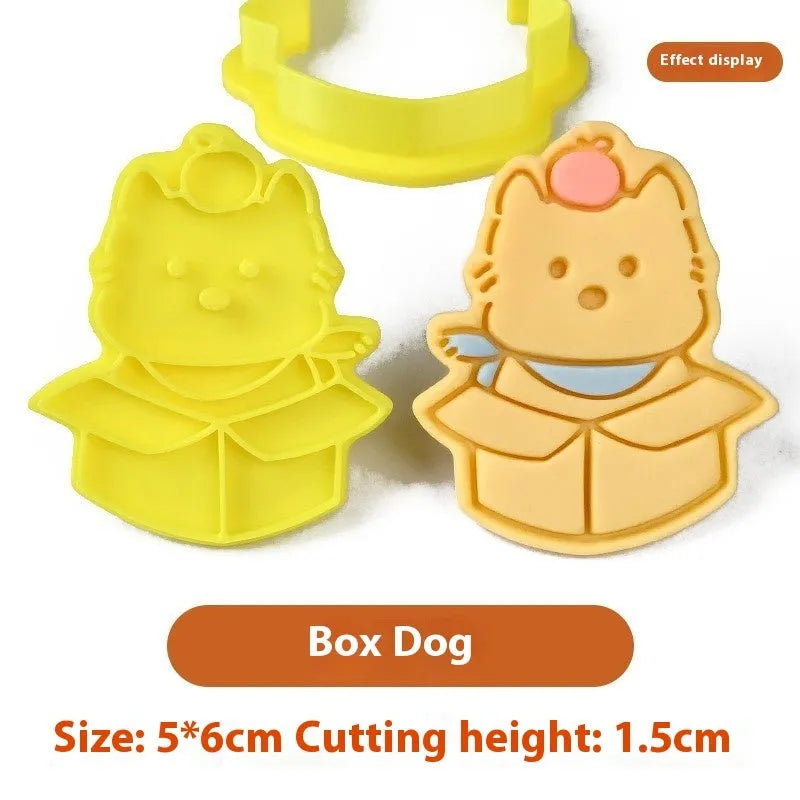 Three dimensional plastic biscuit mold showing puppy head and birthday hat designs