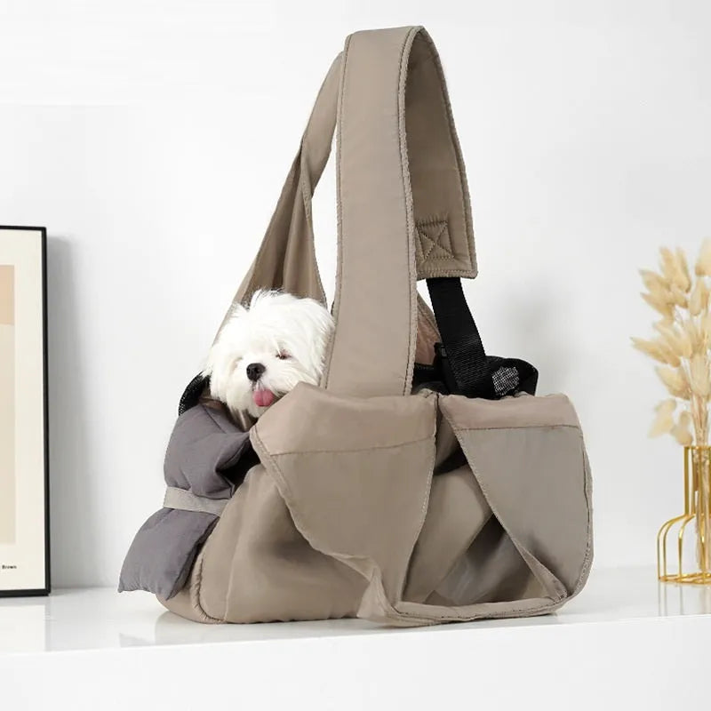 Apricot coloured cloth pet handbag for outdoor summer use.