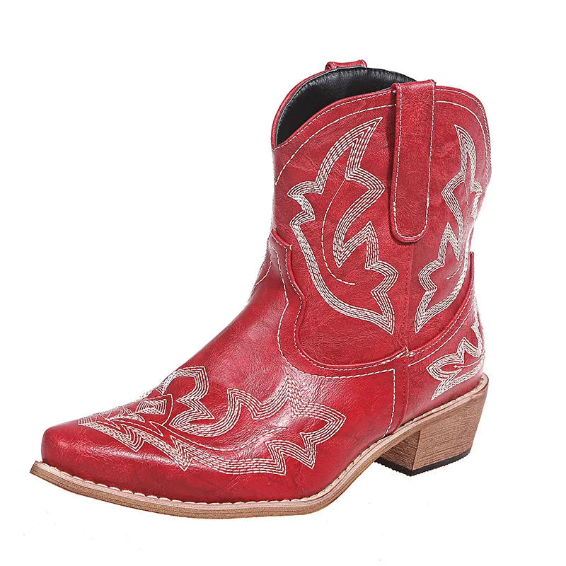 Women's blue embroidered Western cowgirl boots with a low wedge heel and pointed toe.