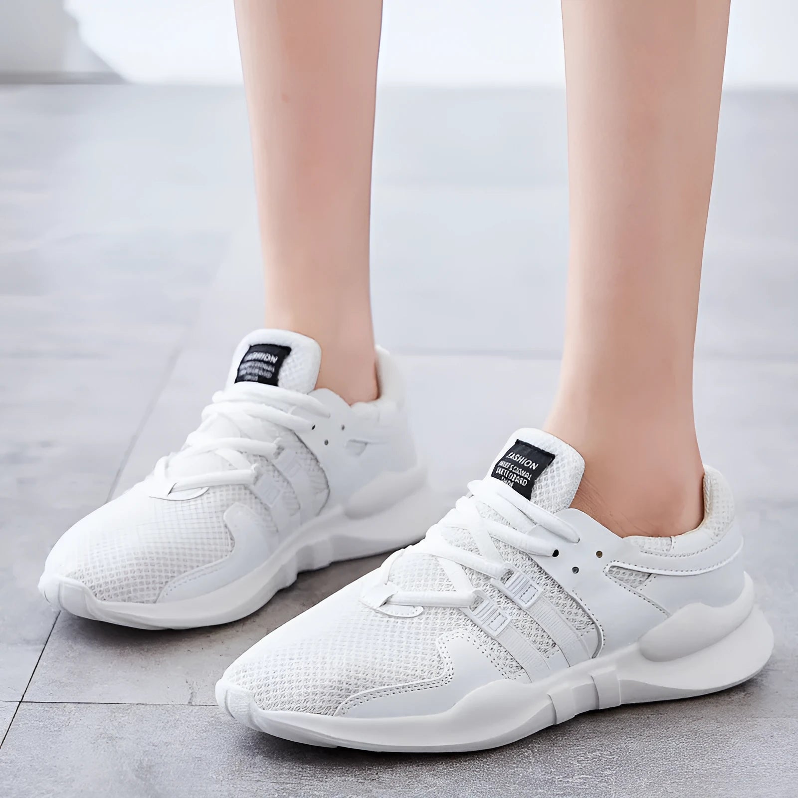Side view of black hollow breathable mesh sneakers with flat EVA sole and round toe design