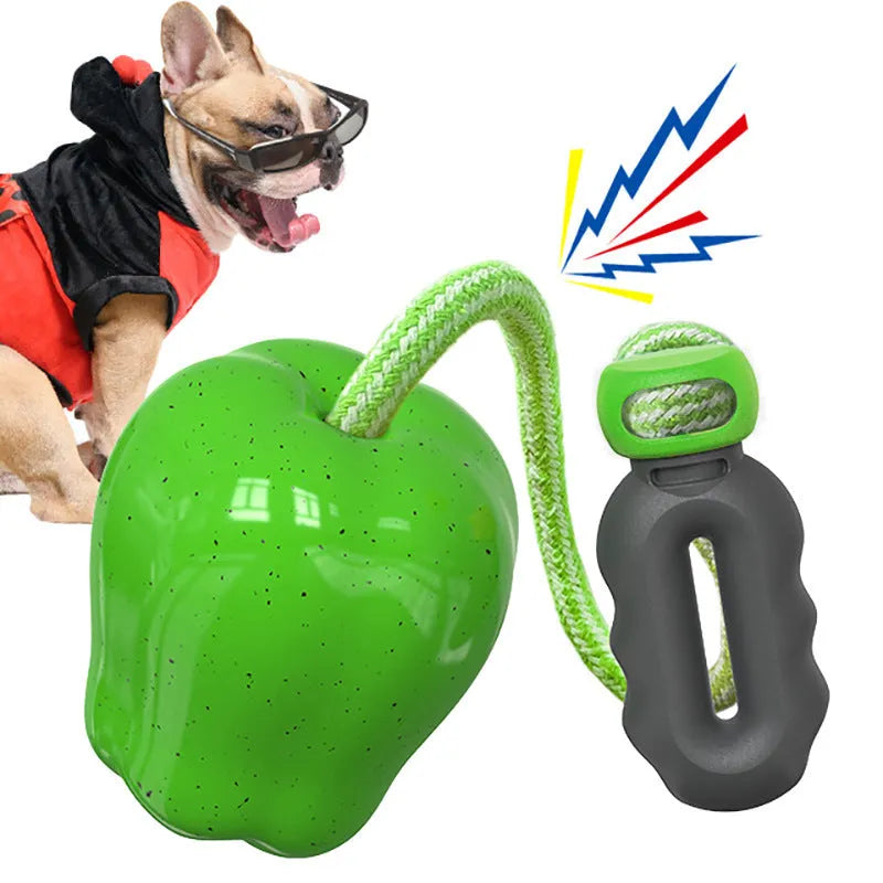 Green plastic apple-shaped dog toy with dropping ball for molar exercise