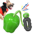 Green plastic apple-shaped dog toy with dropping ball for molar exercise