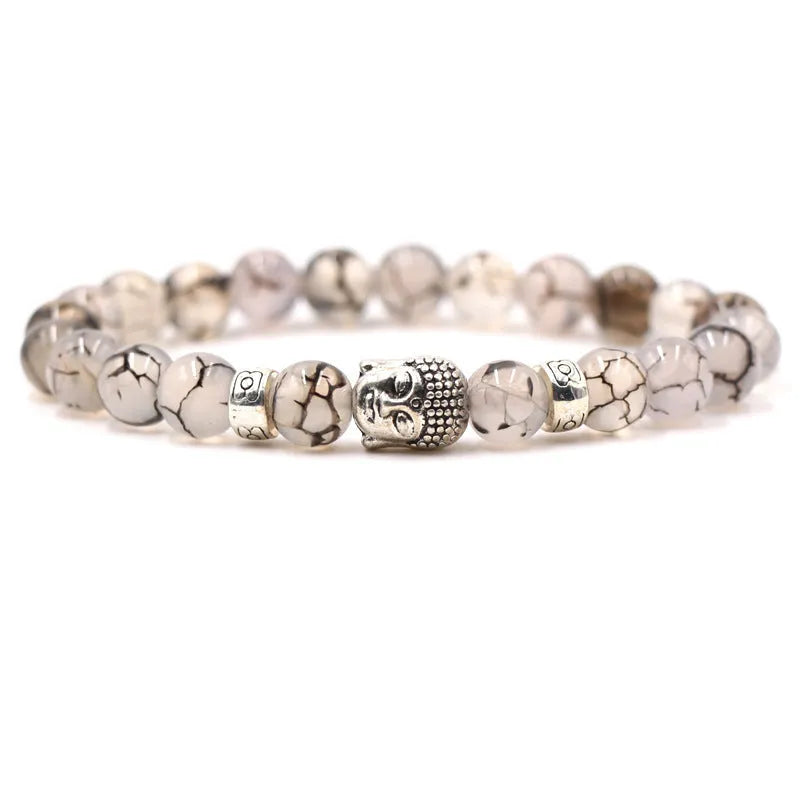 Natural stone stretch bracelet with tigereye, volcanic rock and turquoise beads on wrist
