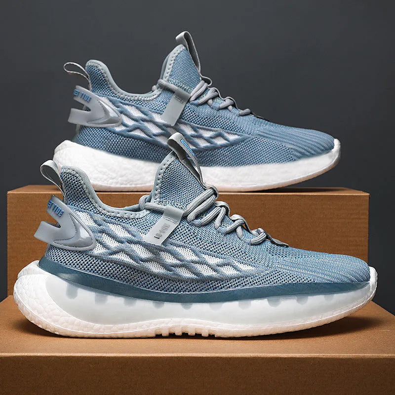 Men's white casual sneakers with woven mesh upper, platform rubber sole, and front lace-up closure.
