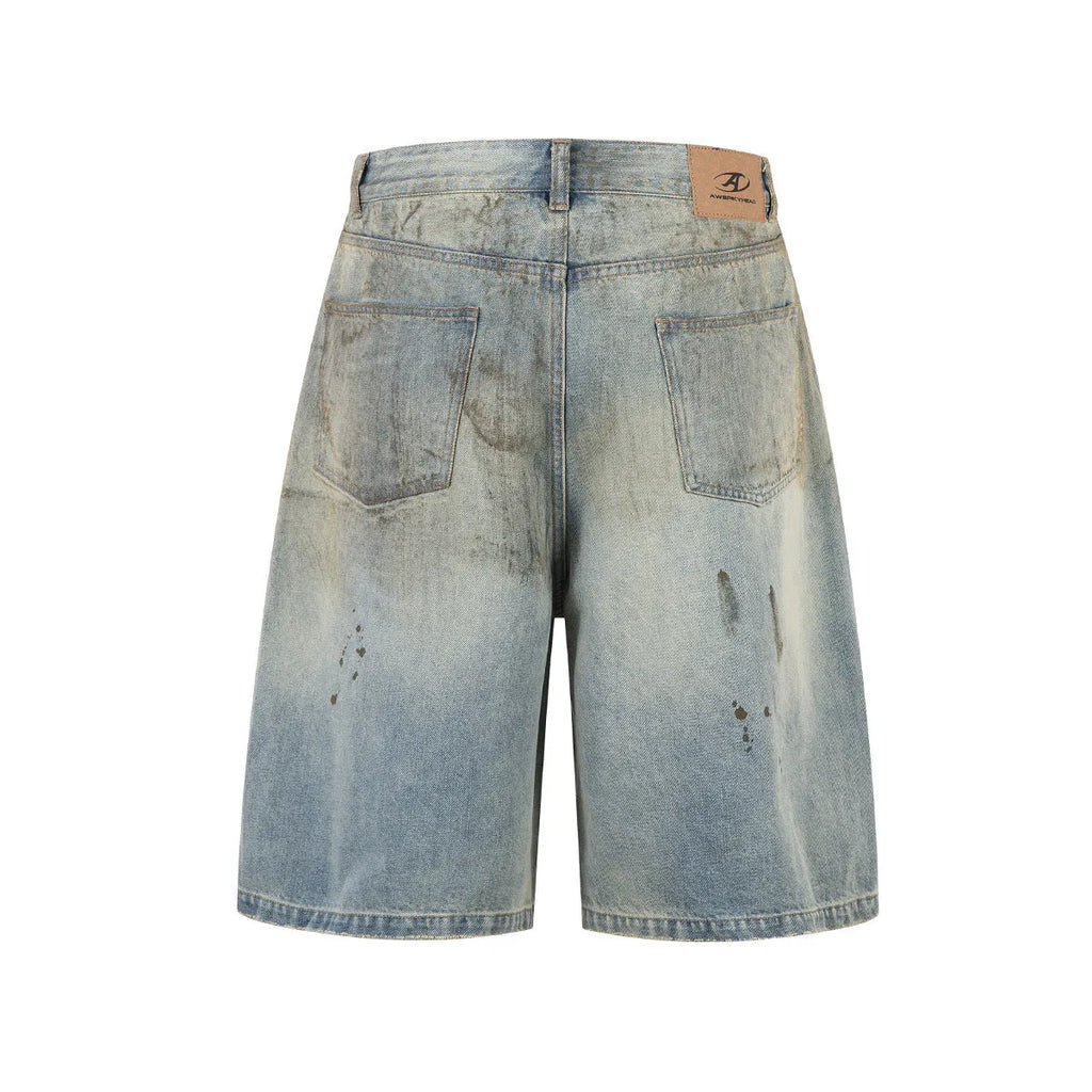 Blue washed cropped straight-leg denim jeans on a model, showing mid-length cut and street-fashion style.