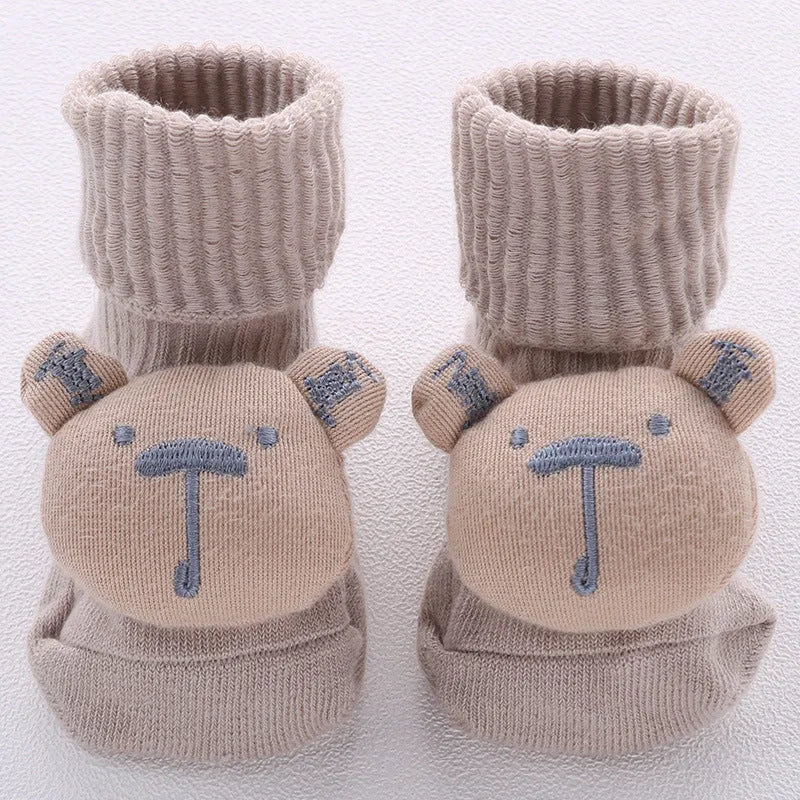 Cotton baby floor socks in various patterns including animal prints, stars, and bows for infants aged 0-3 months